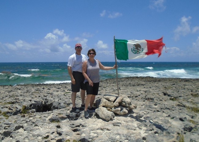 Josh and his wife enjoying the view of the blue sea in Cozumel.